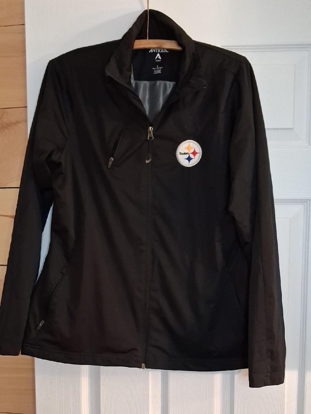 Antigua Black Utility Jacket with Team Patch